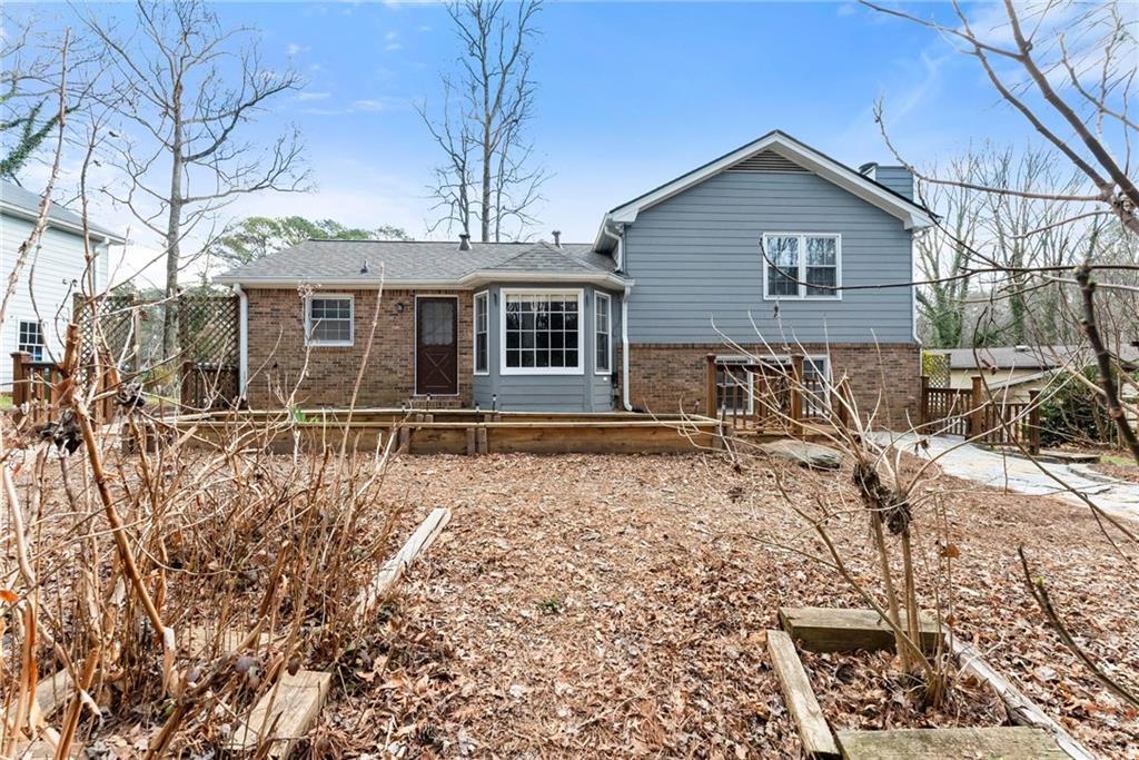 4691 Lucerne Valley Road Southwest Lilburn, GA 30047 - Photo 41 of 55 a front view of a house with a yard