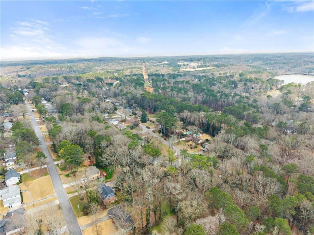 4691 Lucerne Valley Road Southwest Lilburn, GA 30047 - Photo 53 of 55 an aerial view of residential building and green space