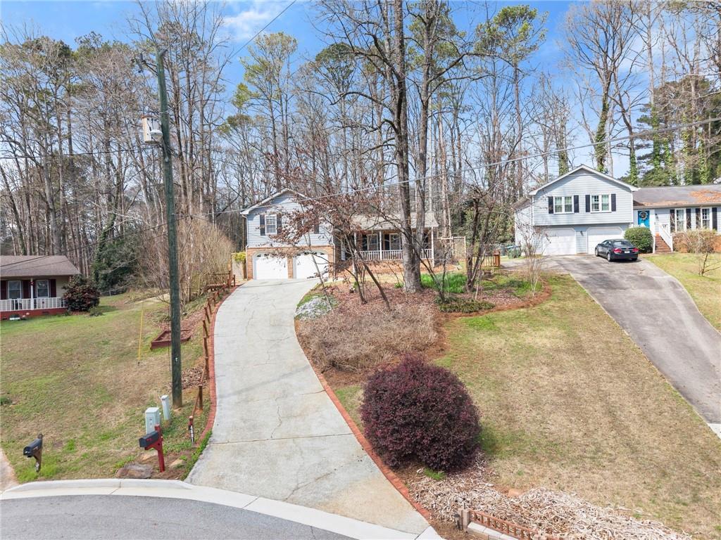 4691 Lucerne Valley Road Southwest Lilburn, GA 30047 - Photo 6 of 55 a view of a street with houses