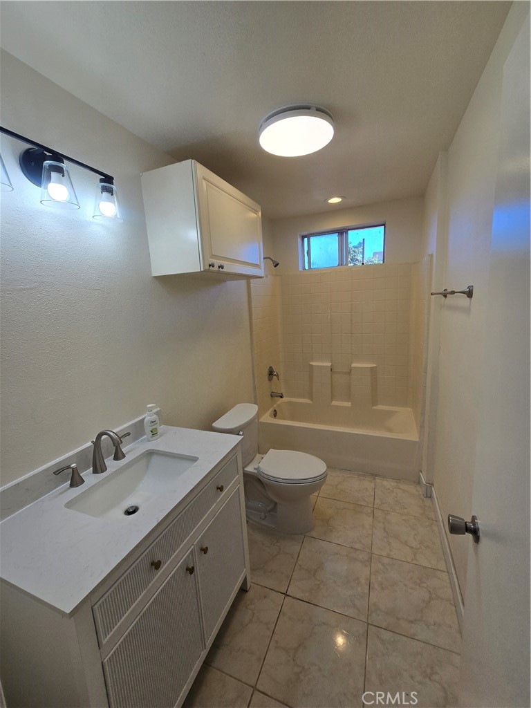 3374 1/2 Fashion Avenue Long Beach, CA 90810 - Photo 7 of 11 a bathroom with a sink a toilet and shower