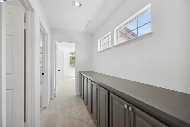 a view of a hallway with workspace