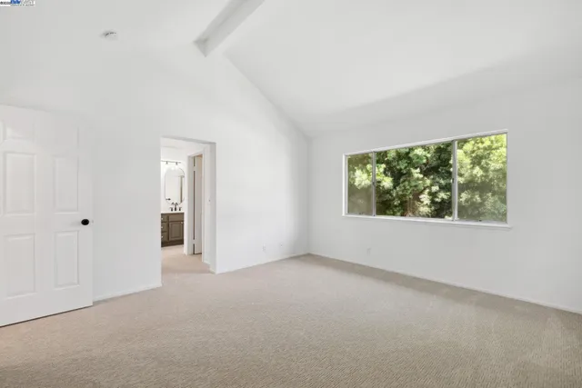 a bathroom with a double vanity sink mirror and shower