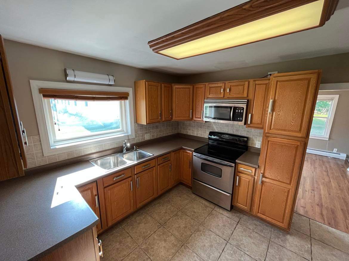145 West Southmor Road Morris, IL 60450 - Photo 11 of 16 a kitchen with stainless steel appliances granite countertop a sink stove and refrigerator