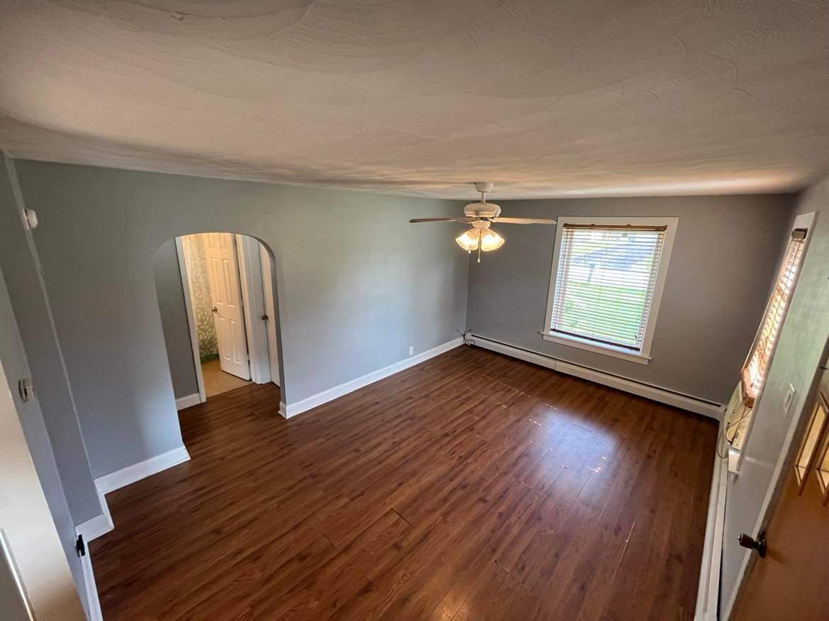 145 West Southmor Road Morris, IL 60450 - Photo 7 of 16 an empty room with wooden floor and windows