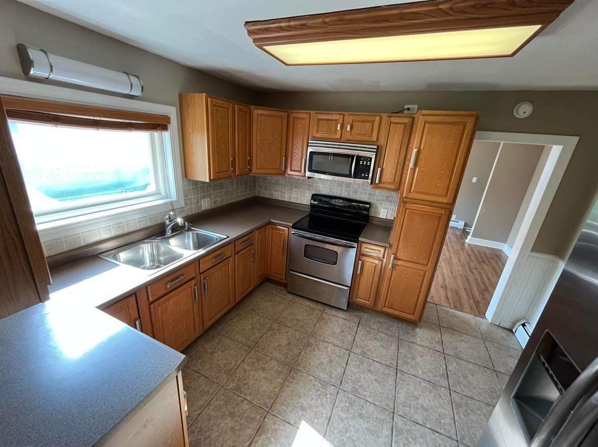 145 West Southmor Road Morris, IL 60450 - Photo 10 of 16 a kitchen with stainless steel appliances granite countertop a sink stove and microwave