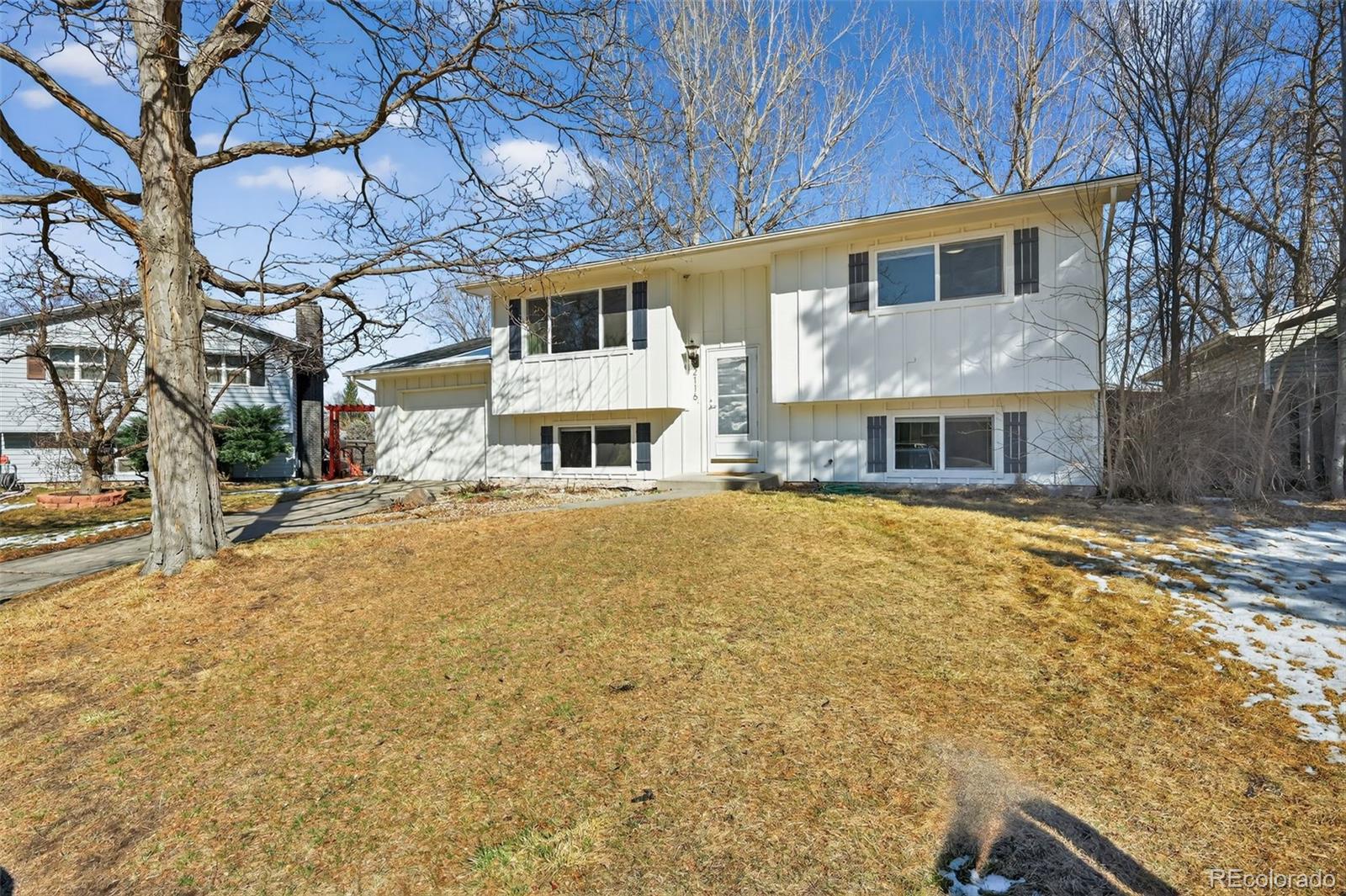 2116 Springfield Court Fort Collins, CO 80521 - Photo 1 of 29 a front view of a house with a yard