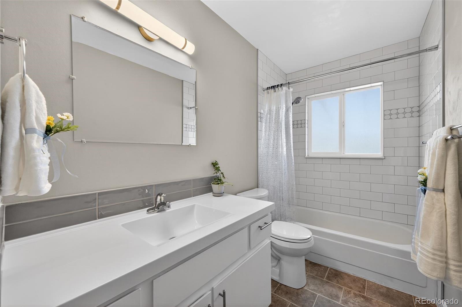 2116 Springfield Court Fort Collins, CO 80521 - Photo 11 of 29 a bathroom with a sink toilet and shower