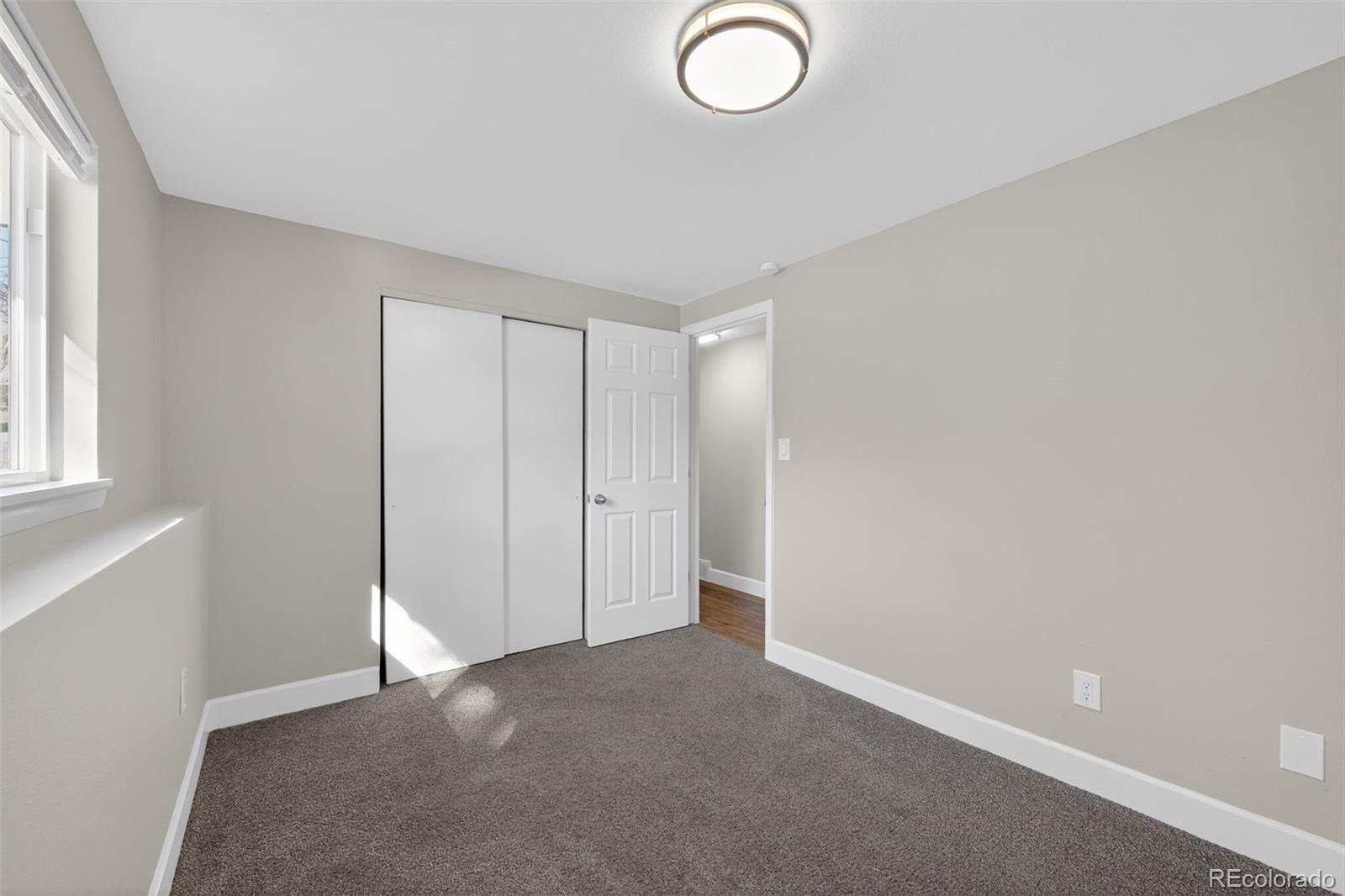 2116 Springfield Court Fort Collins, CO 80521 - Photo 12 of 29 a view of an empty room and window