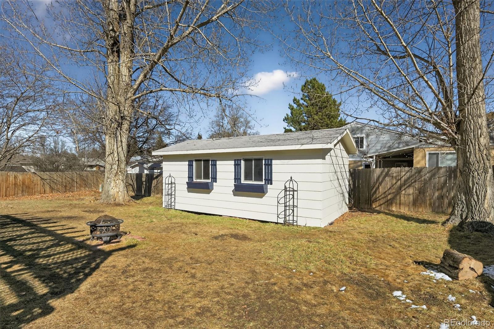 2116 Springfield Court Fort Collins, CO 80521 - Photo 2 of 29 a view of a house with a yard covered in snow