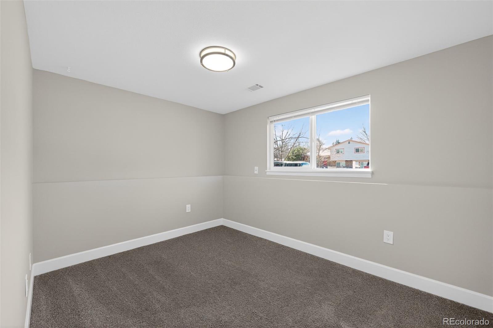 2116 Springfield Court Fort Collins, CO 80521 - Photo 23 of 29 an empty room with windows