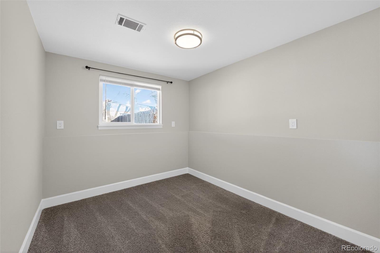 2116 Springfield Court Fort Collins, CO 80521 - Photo 24 of 29 an empty room with windows and closet