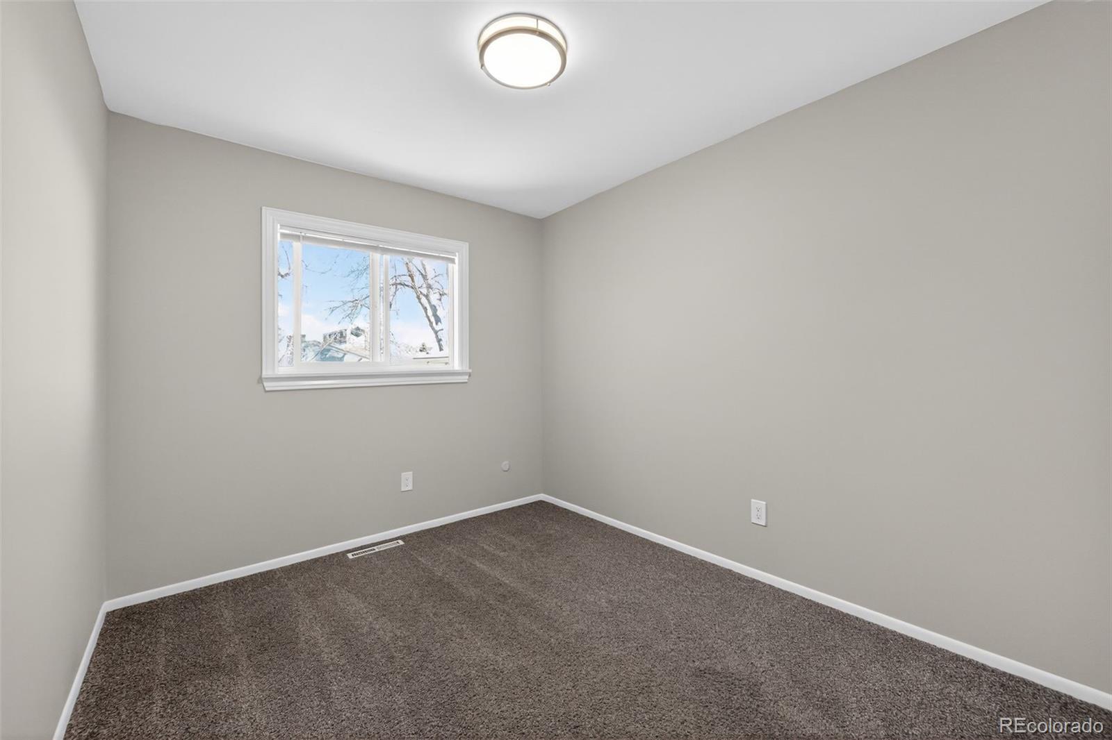 2116 Springfield Court Fort Collins, CO 80521 - Photo 26 of 29 an empty room with windows