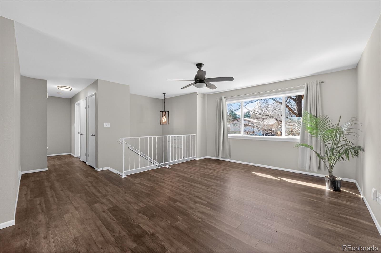 2116 Springfield Court Fort Collins, CO 80521 - Photo 28 of 29 a view of livingroom with window and wooden floor