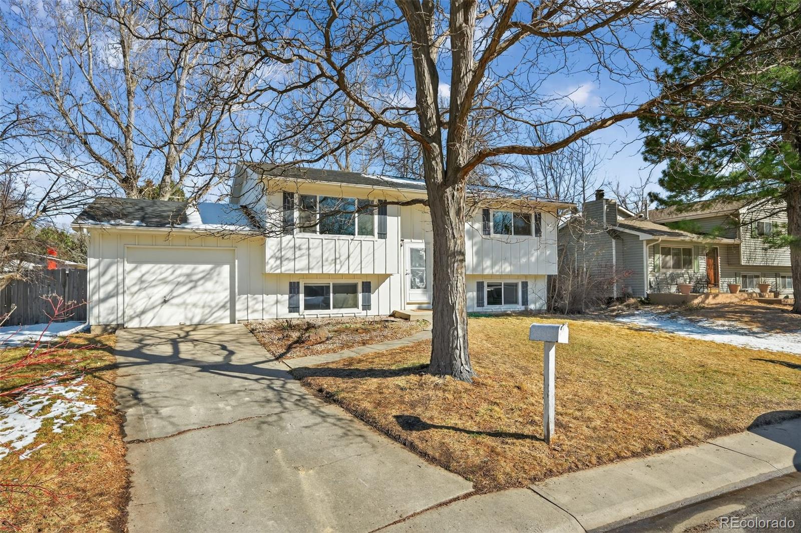 2116 Springfield Court Fort Collins, CO 80521 - Photo 4 of 29 a front view of a house with a yard