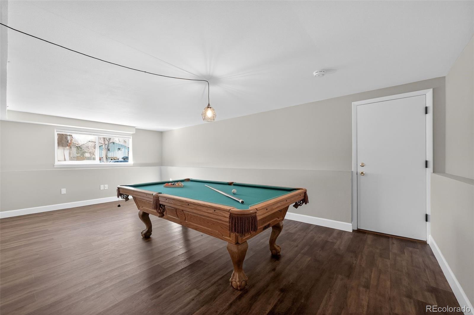 2116 Springfield Court Fort Collins, CO 80521 - Photo 5 of 29 a room with wooden floors and pool table