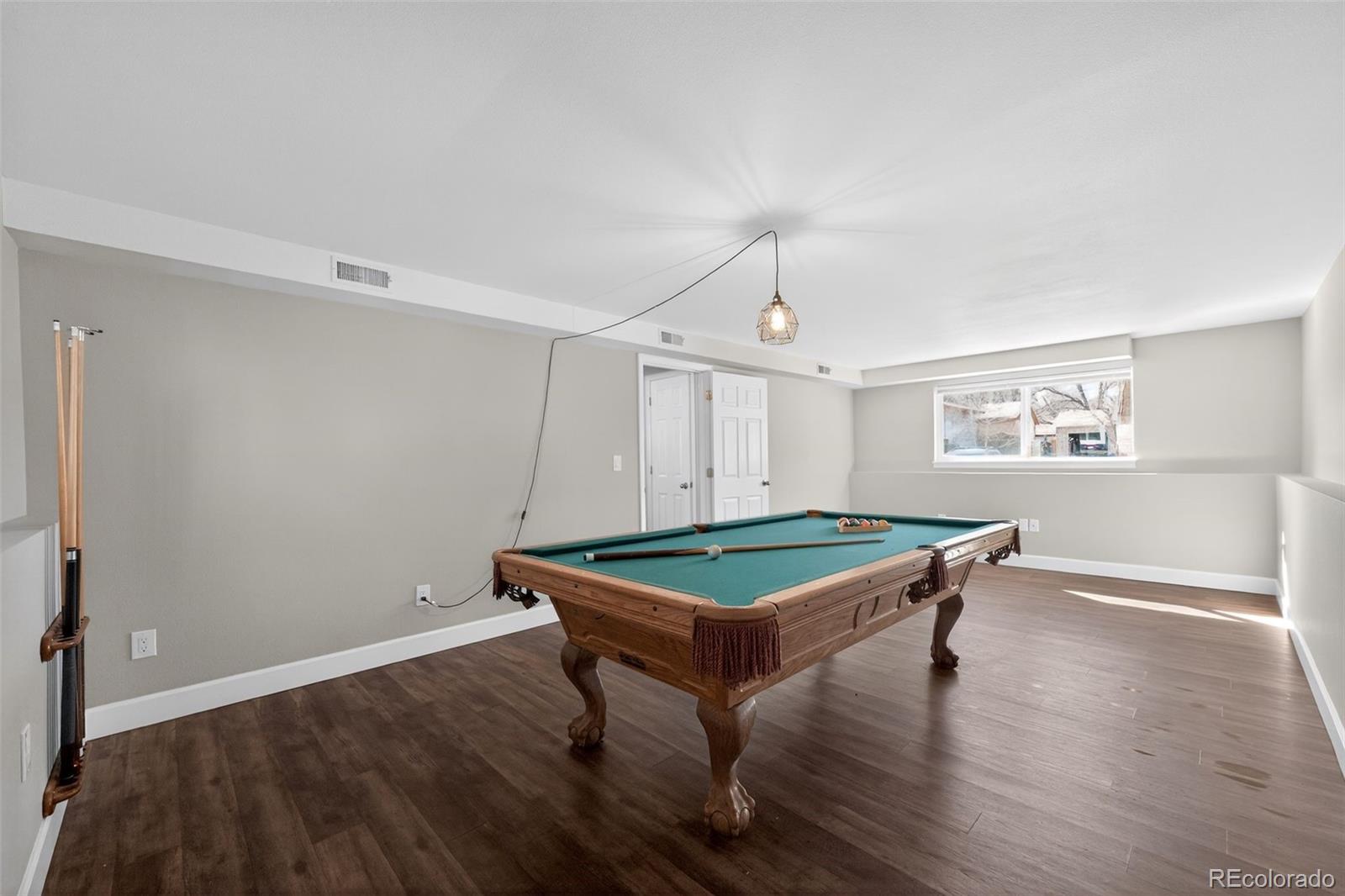 2116 Springfield Court Fort Collins, CO 80521 - Photo 6 of 29 a room with wooden floor and pool table
