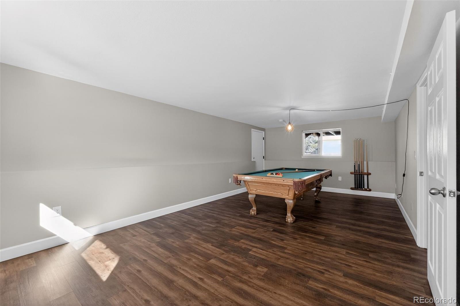 2116 Springfield Court Fort Collins, CO 80521 - Photo 8 of 29 a view of a room with wooden floor and a window