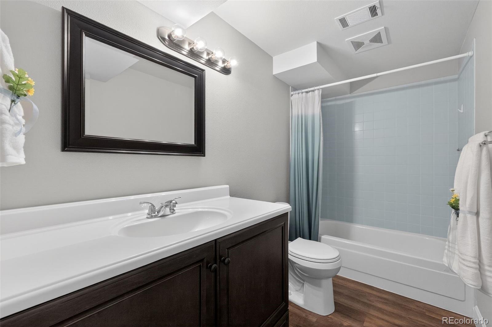 2116 Springfield Court Fort Collins, CO 80521 - Photo 10 of 29 a bathroom with a toilet a sink and bathtub