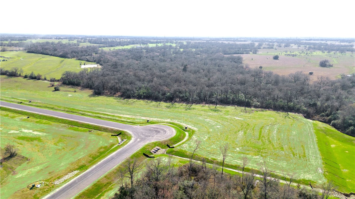 Tbd Tbd Plata Way Bryan, TX 77808 - Photo 9 of 18 a view of a swimming pool with a lake view