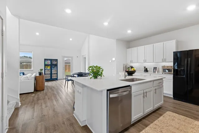 a view of a dining room with furniture and a window