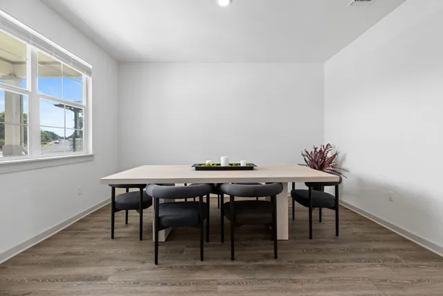 a bathroom with a toilet sink vanity and mirror