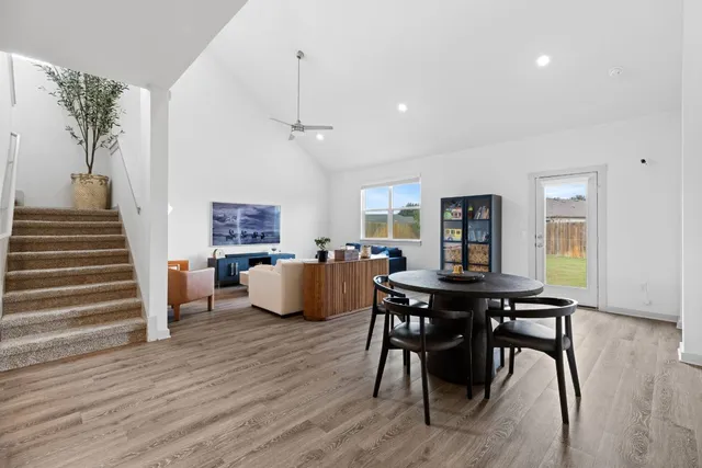 a living room with furniture and kitchen view