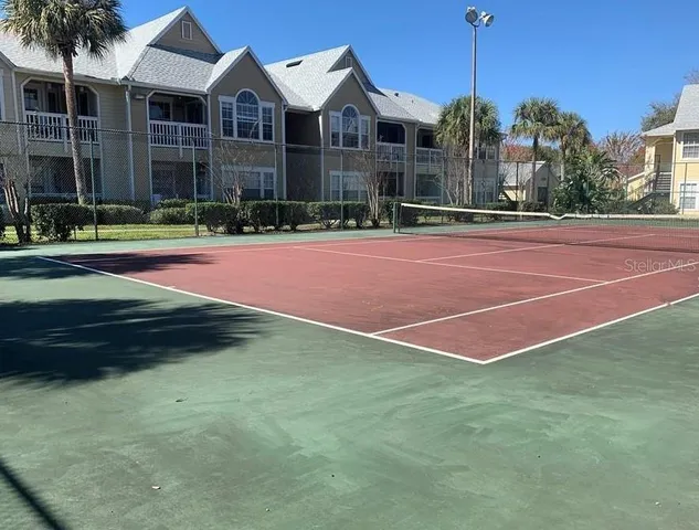 a view of a building and a yard in the background