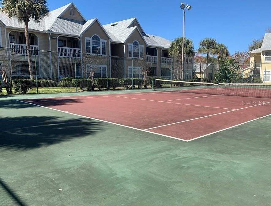 1071 South Hiawassee Road, Unit 1214 Orlando, FL 32835 - Photo 12 of 17 a view of a building and a yard in the background