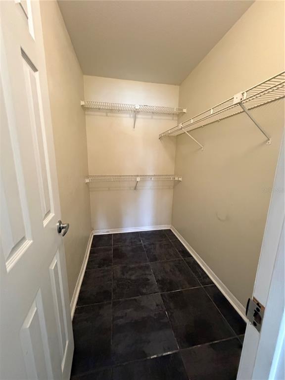 1071 South Hiawassee Road, Unit 1214 Orlando, FL 32835 - Photo 9 of 17 a view of a walk in closet