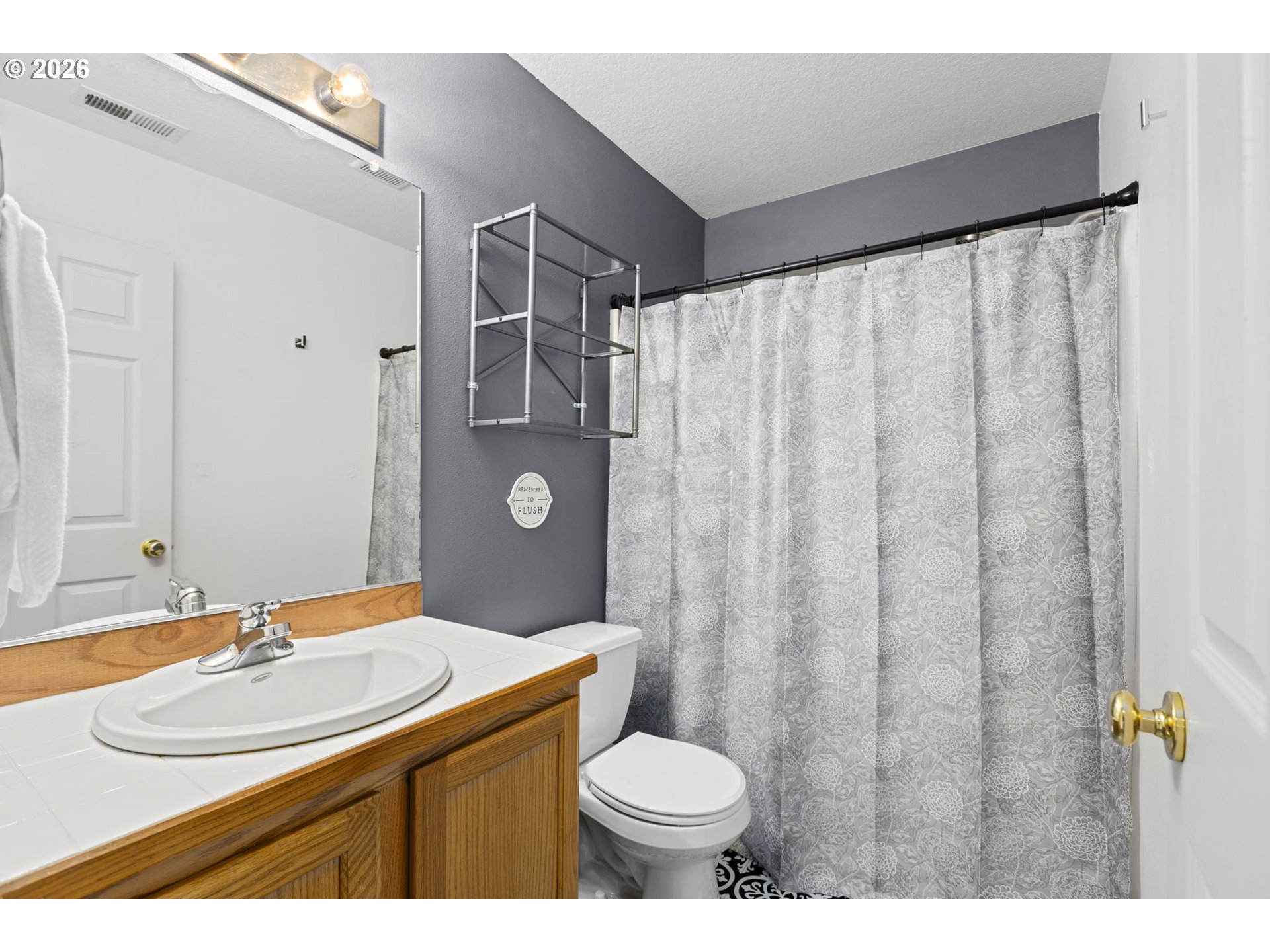 3418 Northwest 30th Circle Camas, WA 98607 - Photo 23 of 43 a bathroom with a sink toilet and shower