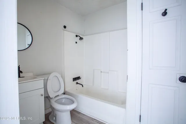 a bathroom with a sink toilet and a bathtub