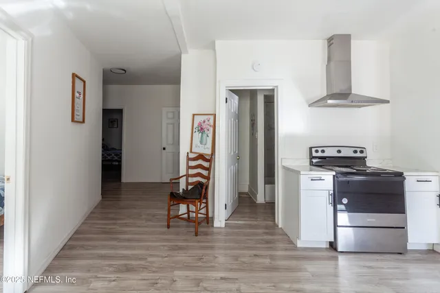 a kitchen with stainless steel appliances a refrigerator and a stove