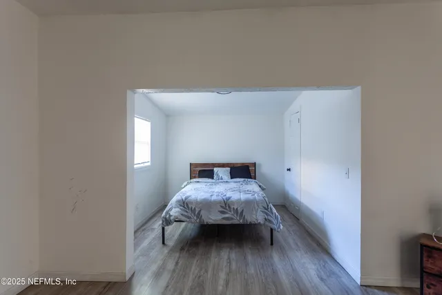 a room with a bed and a window