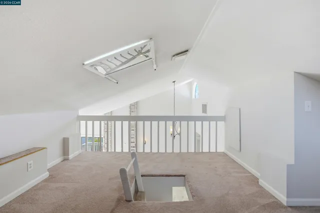 a view of staircase with white walls