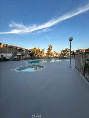 a view of a swimming pool with a yard