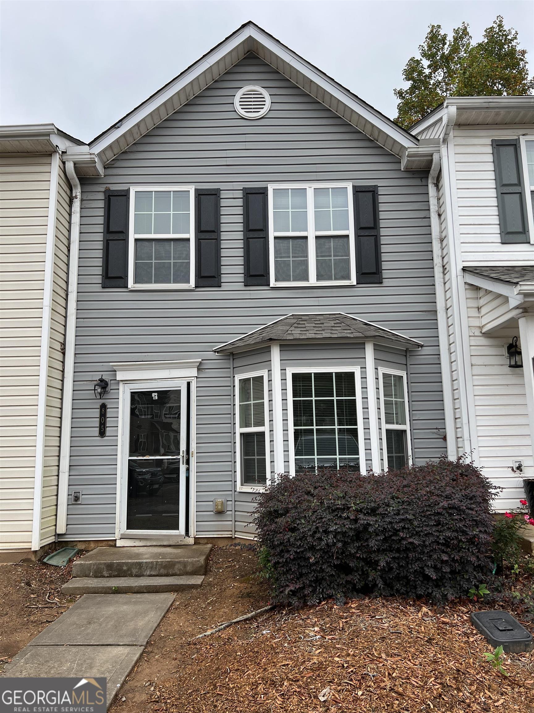 805 Crestwell Circle Atlanta, GA 30331 - Photo 2 of 12 a front view of a house with a garden