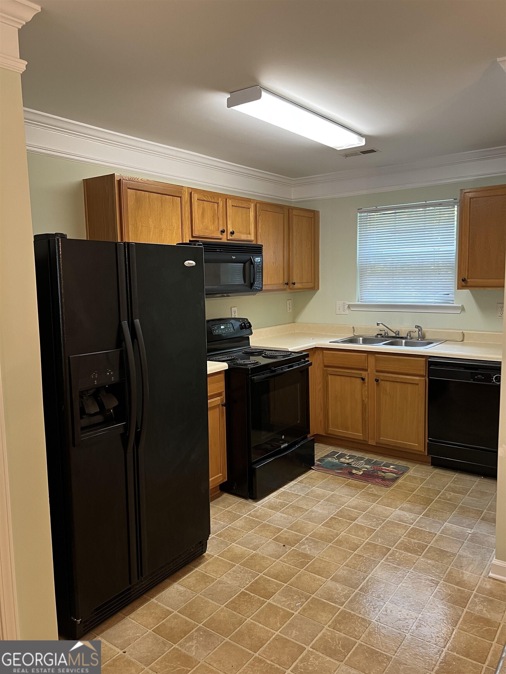 805 Crestwell Circle Atlanta, GA 30331 - Photo 5 of 12 a kitchen with stainless steel appliances granite countertop a refrigerator and a sink