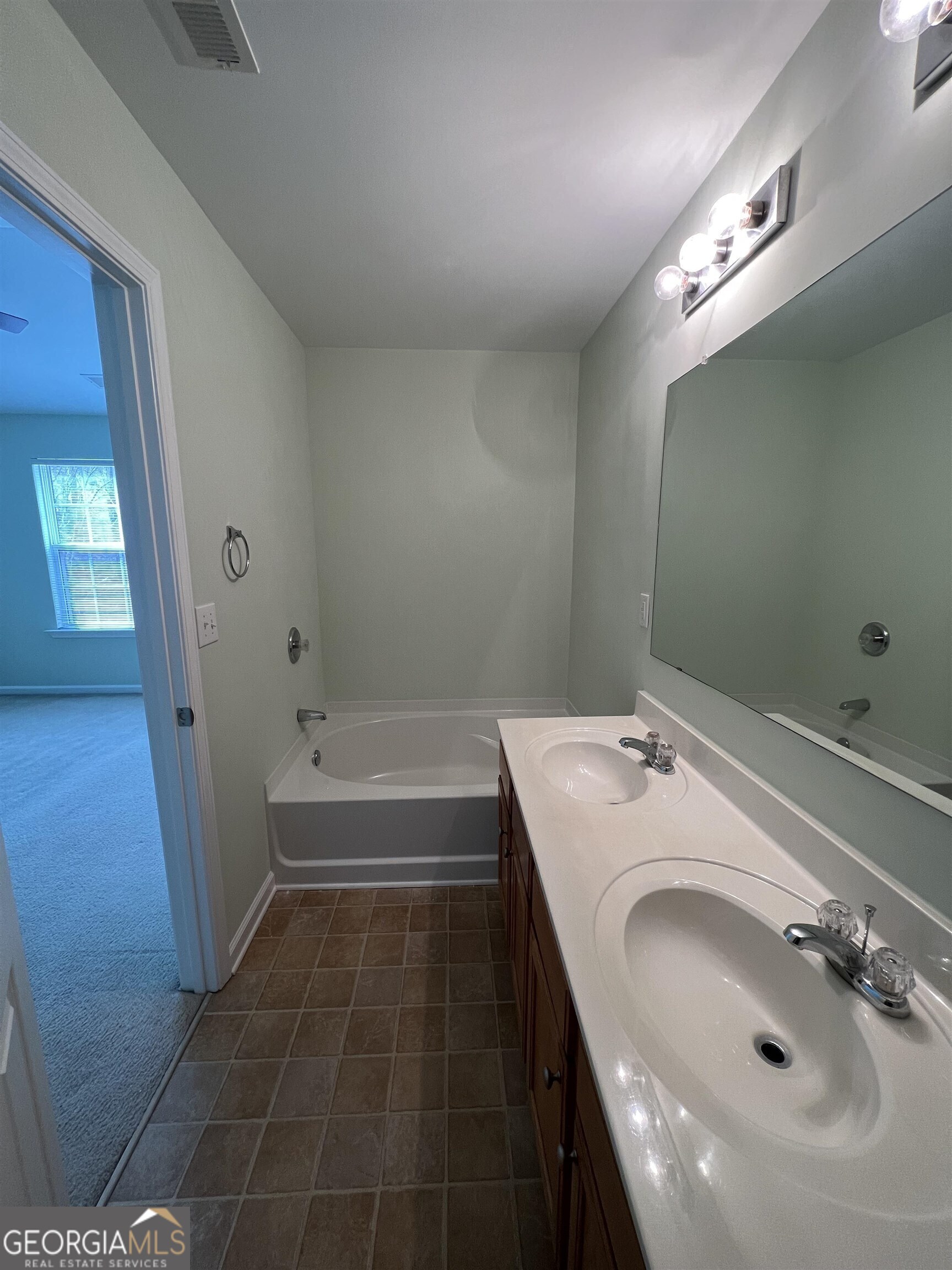 805 Crestwell Circle Atlanta, GA 30331 - Photo 9 of 12 a bathroom with a sink and a tub