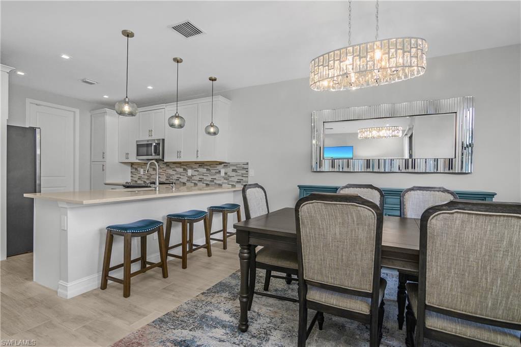 7588 Morgan Way Naples, FL 34119 - Photo 14 of 42 Dining Room/Kitchen views