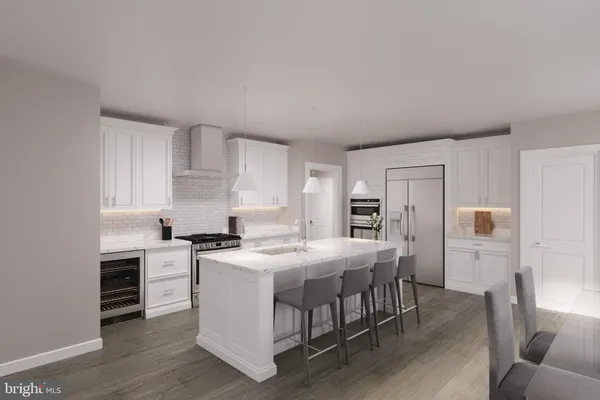 a kitchen that has a table and chairs in it