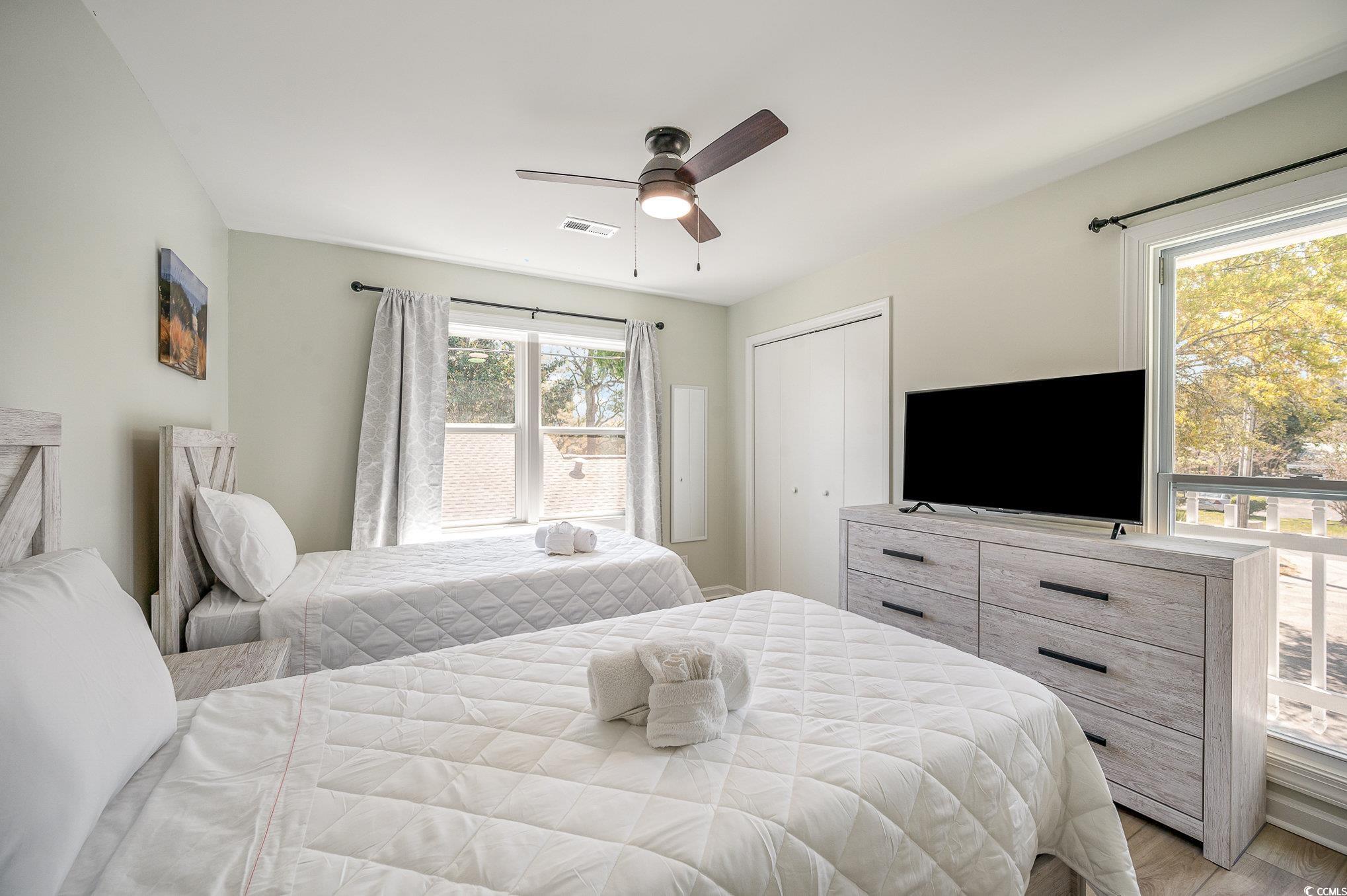 412 27th Avenue North Myrtle Beach, SC 29577 - Photo 14 of 35 Bedroom featuring a closet and ceiling fan
