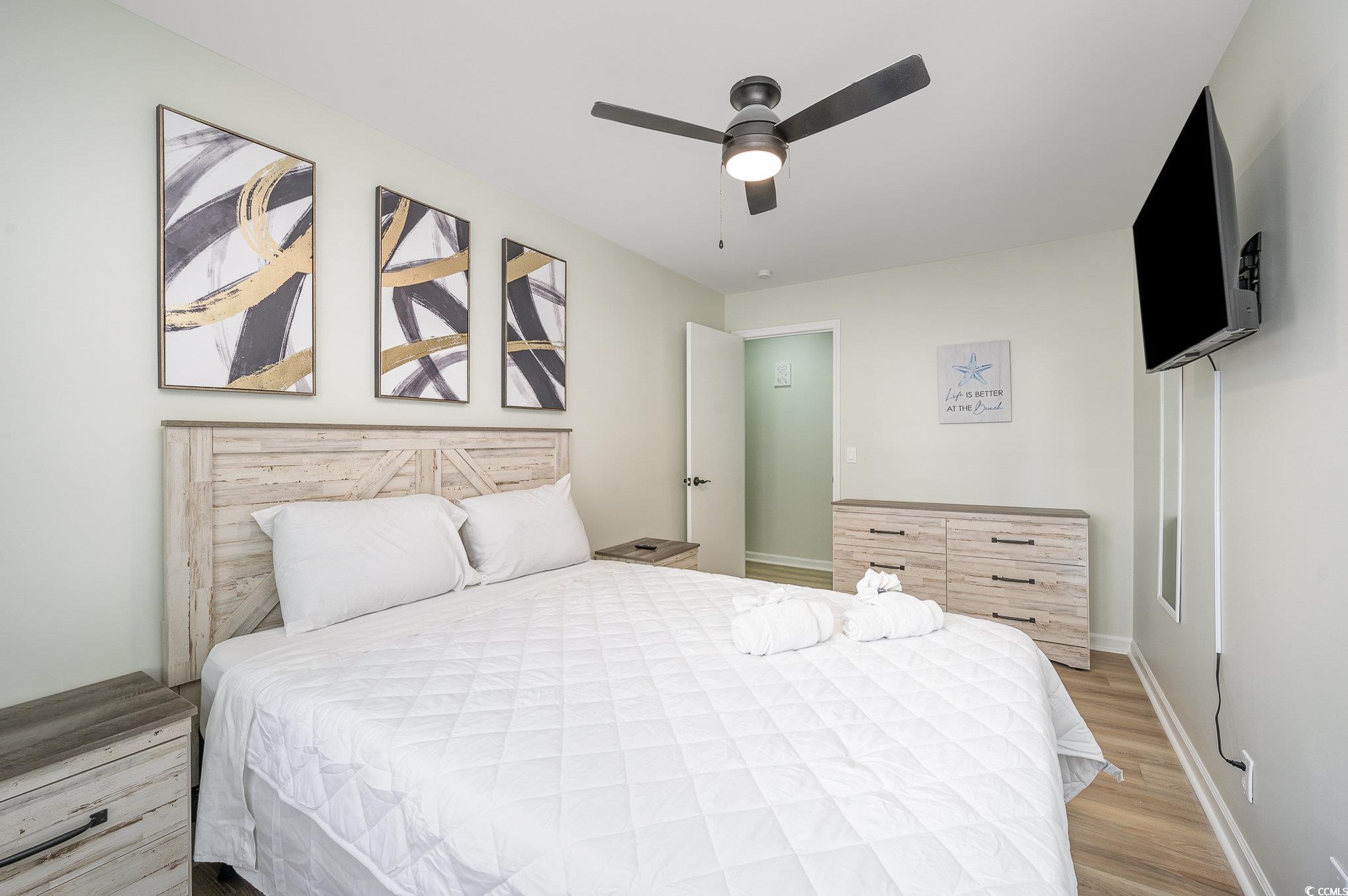 412 27th Avenue North Myrtle Beach, SC 29577 - Photo 17 of 35 Bedroom with a ceiling fan and light wood-style flooring