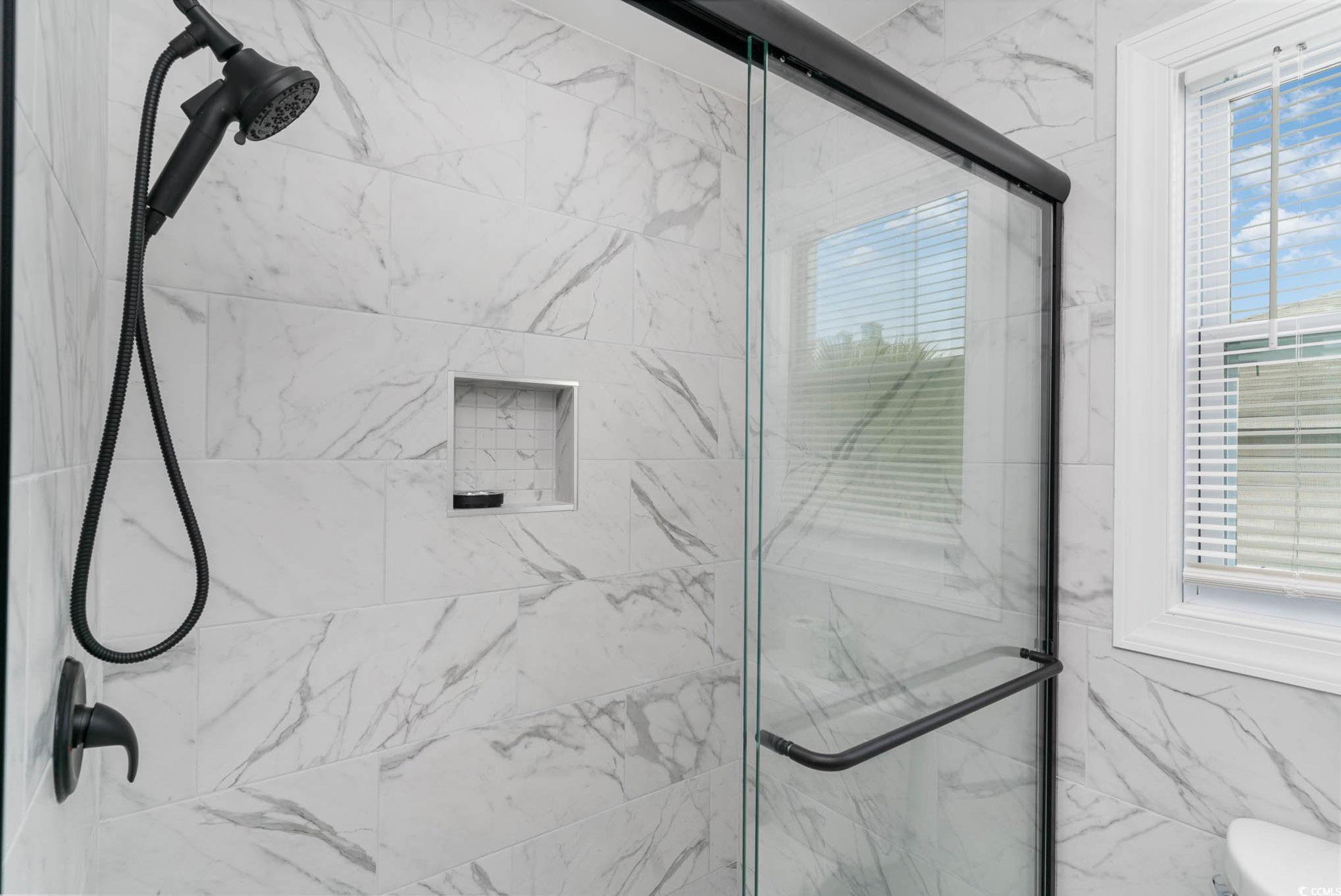 412 27th Avenue North Myrtle Beach, SC 29577 - Photo 23 of 35 Bathroom featuring a marble finish shower