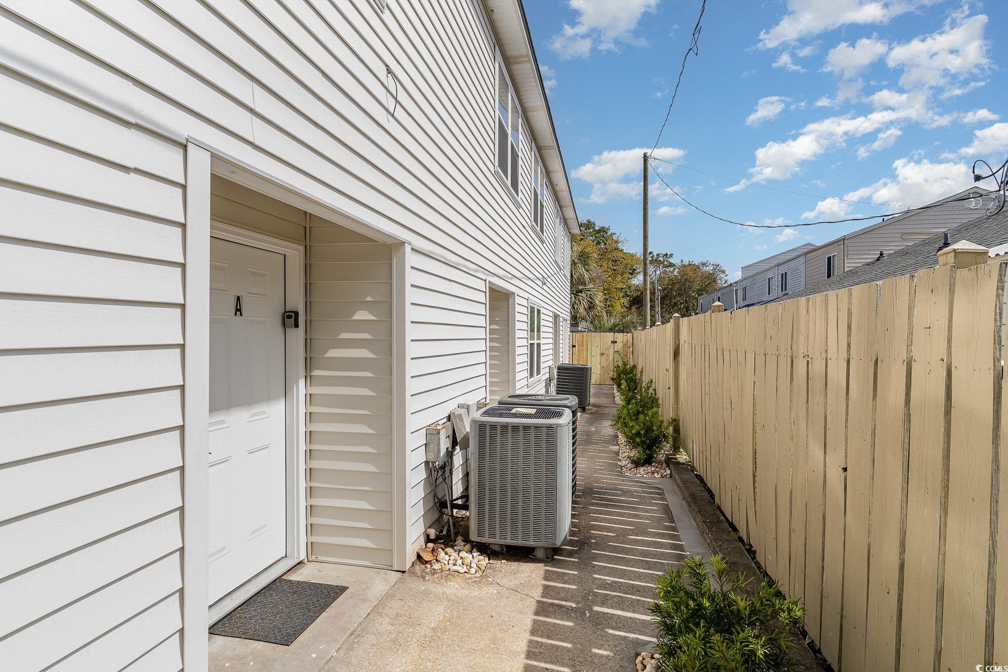 412 27th Avenue North Myrtle Beach, SC 29577 - Photo 25 of 35 View of side of home featuring a cooling unit