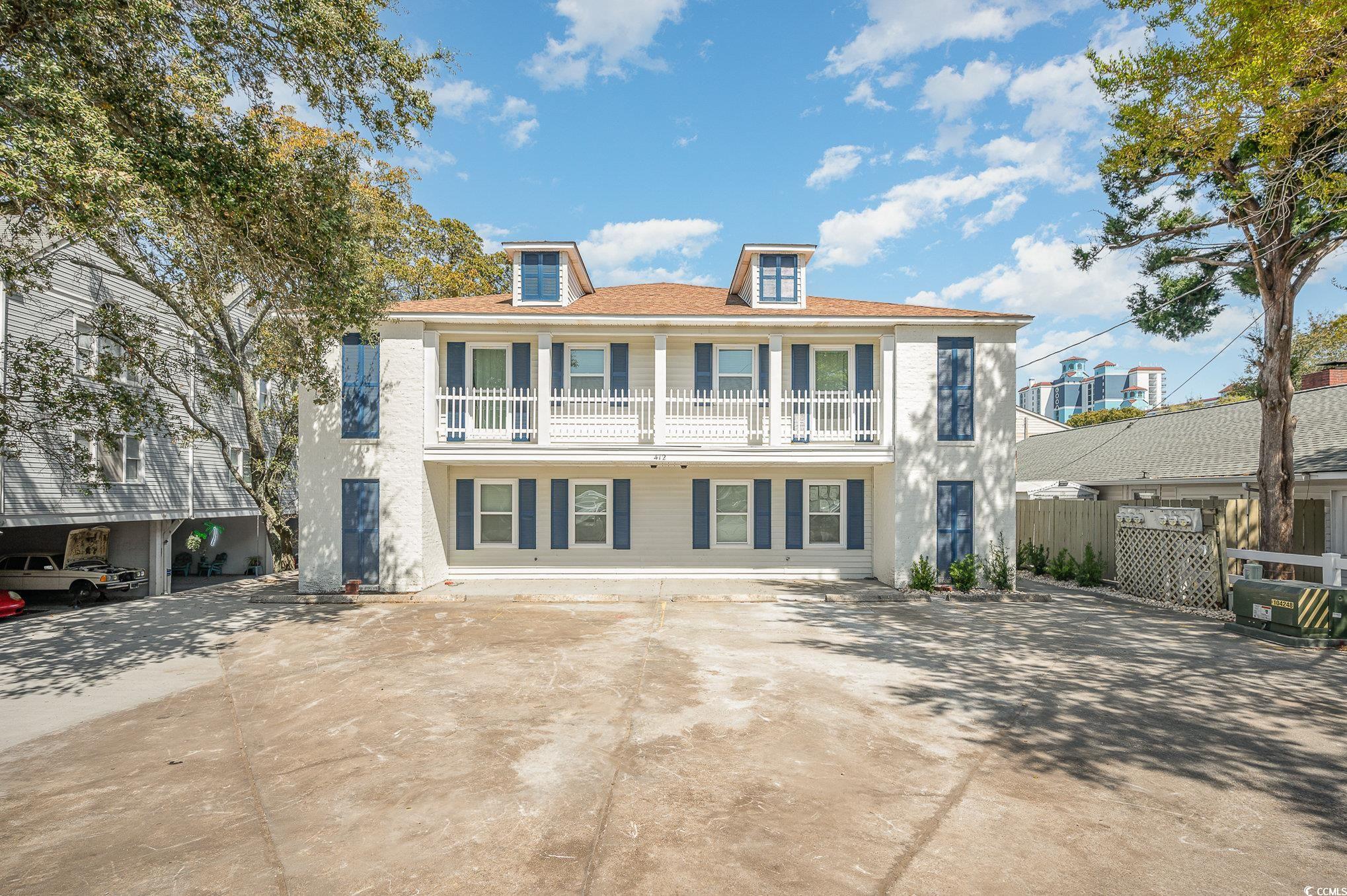 412 27th Avenue North Myrtle Beach, SC 29577 - Photo 28 of 35 View of front of house with a balcony, driveway, and stucco siding