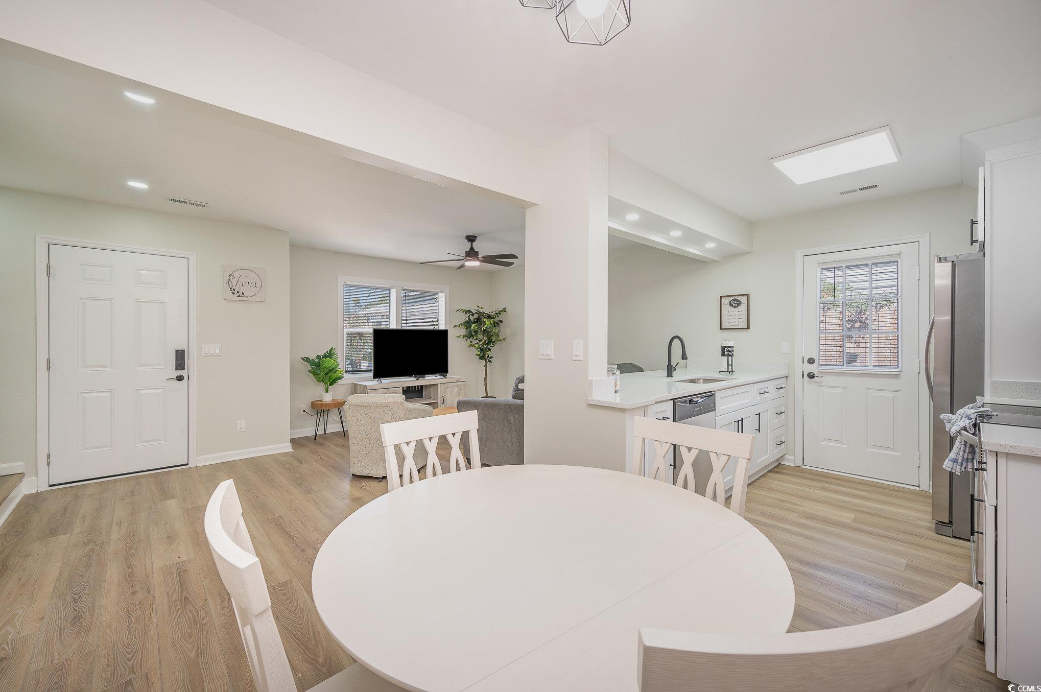 412 27th Avenue North Myrtle Beach, SC 29577 - Photo 9 of 35 Dining area with light wood-style flooring, recessed lighting, and a ceiling fan