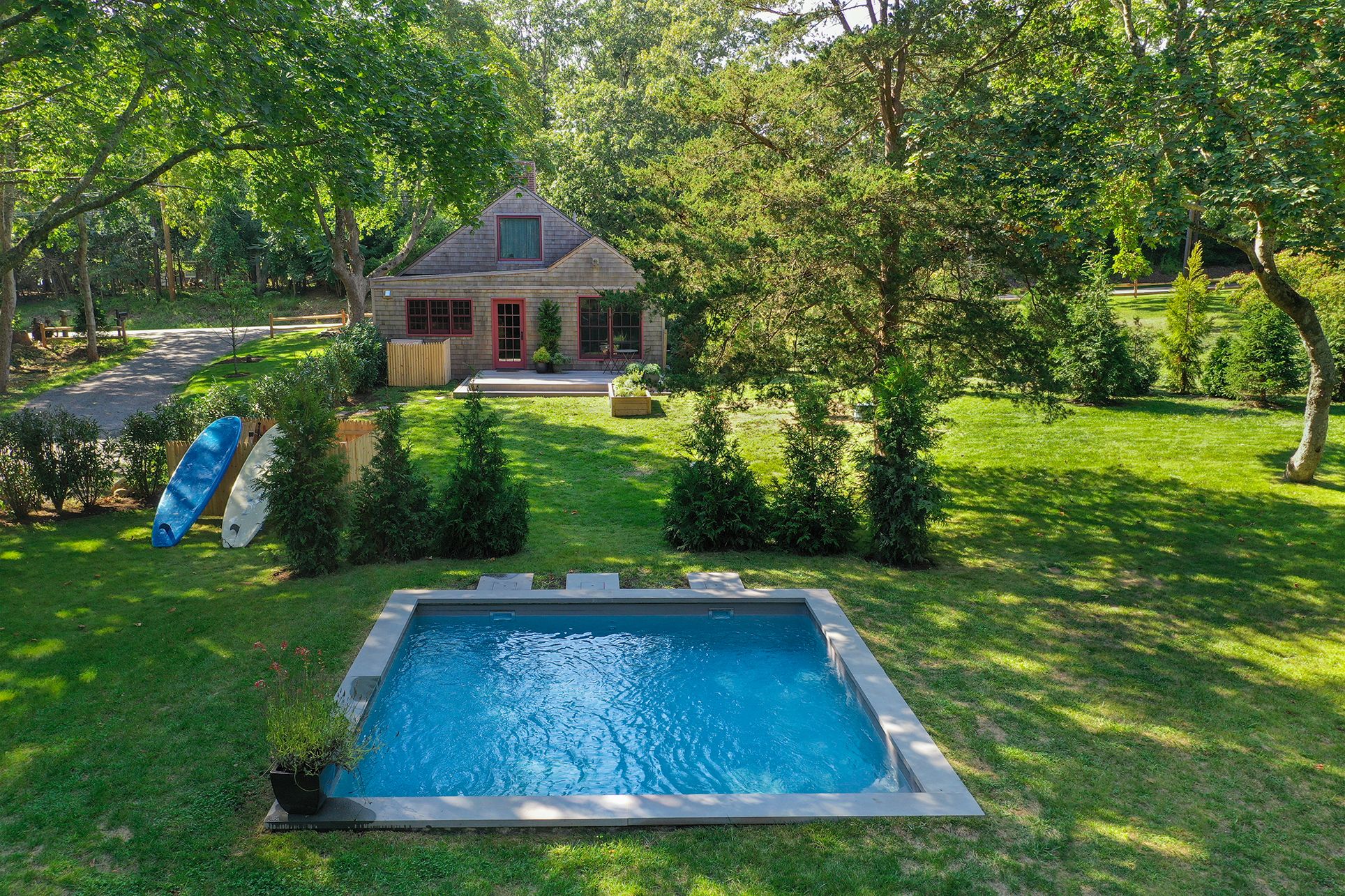 240 Three Mile Harbor Road East Hampton, NY 11937 - Photo 12 of 14 a front view of a house with garden