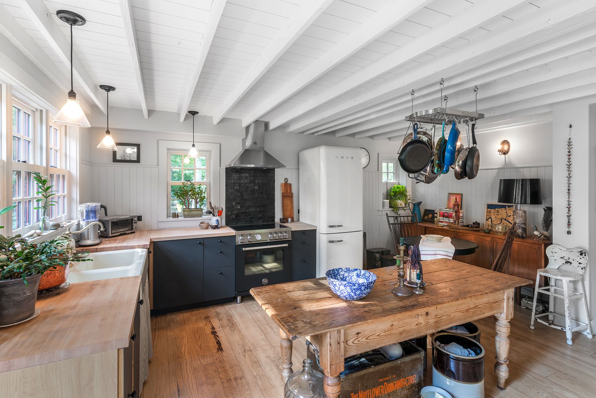 240 Three Mile Harbor Road East Hampton, NY 11937 - Photo 5 of 14 a view of kitchen and dining area with furniture