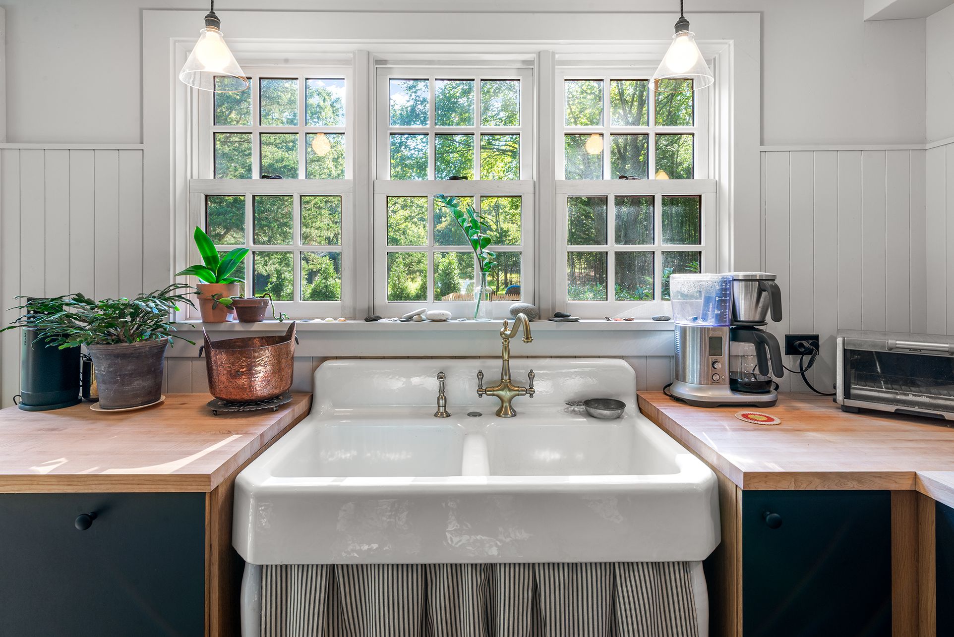 240 Three Mile Harbor Road East Hampton, NY 11937 - Photo 6 of 14 a kitchen with a sink a counter and a window