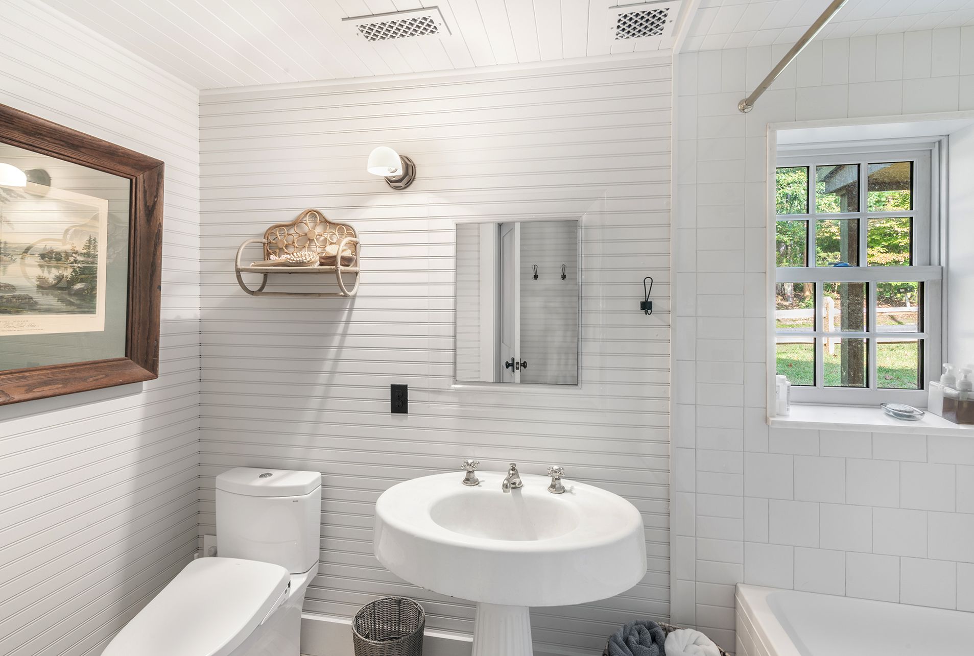 240 Three Mile Harbor Road East Hampton, NY 11937 - Photo 7 of 14 a bathroom with a sink a mirror and a toilet